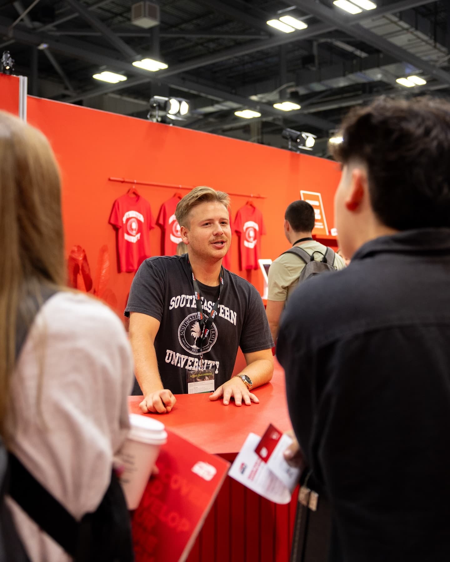 SEU staff talking with visitors