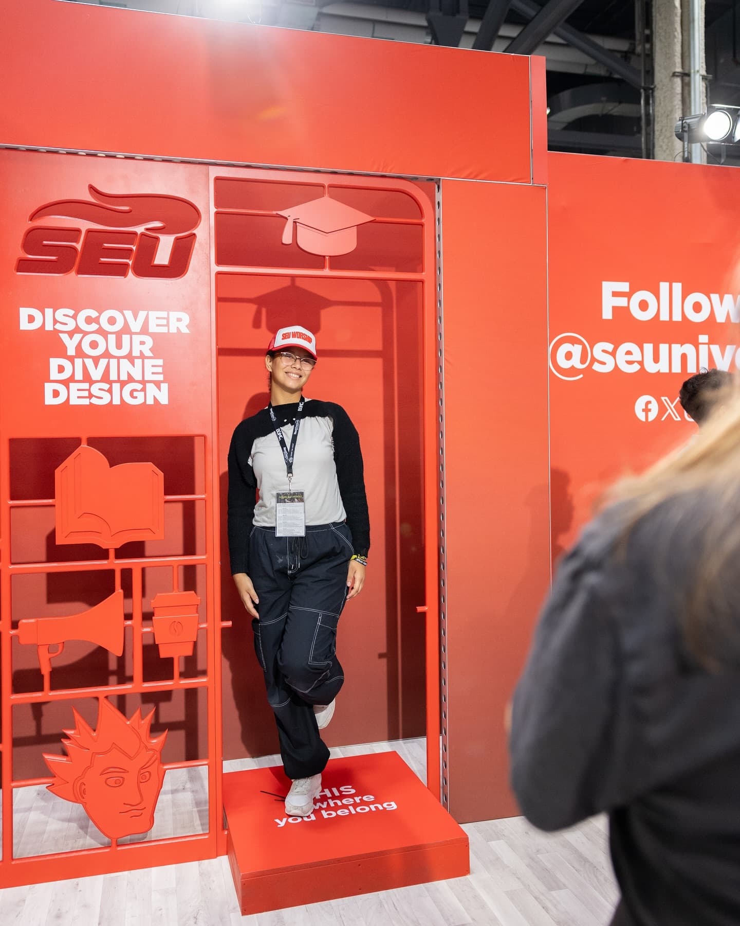 Student posing at SEU booth